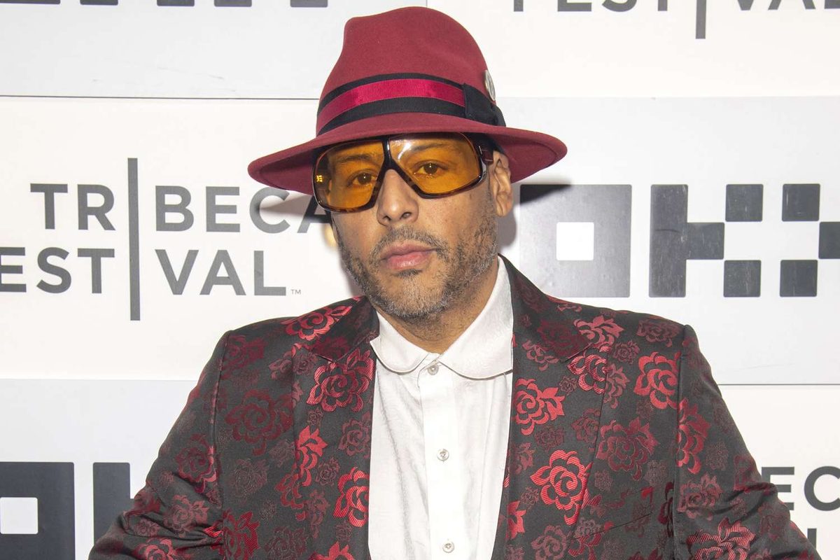 Al B. Sure! in a red hat and floral jacket at a Tribeca Festival event