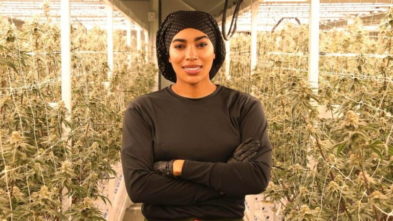 Dreka Gates standing in a cannabis grow room